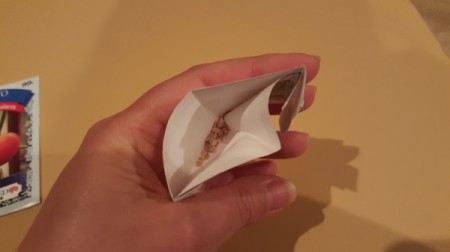 An open packet of seeds.