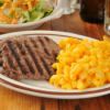 cube steak with mac and cheese and a side salad