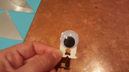 A googly eye and bread tie decoration.