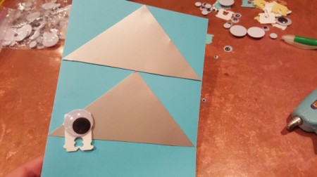 A googly eye monster on the front of a card.