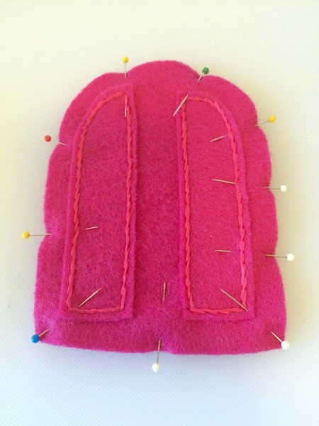 The outer felt pieces are pinned together.