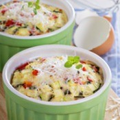 two baking dishes with veggie omelettes