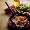 steak in skillet with corn and beans