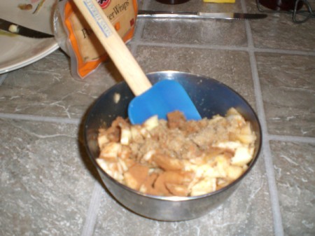 mixing apples, brown sugar & spices