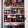 A fully stocked pantry with canned goods.