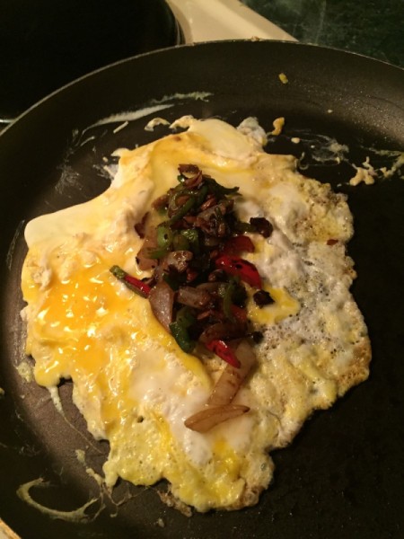 omelet with veggies on top