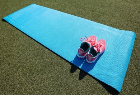 shoes on a yoga mat