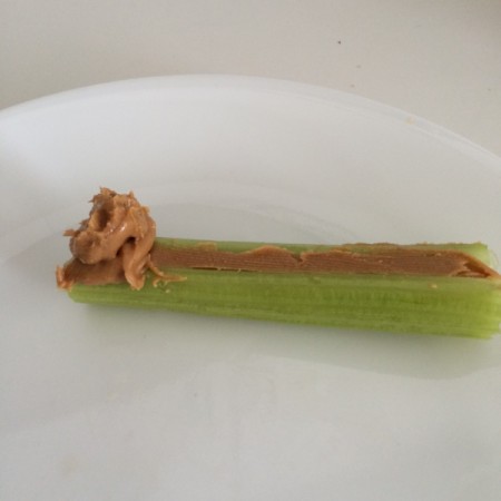 adding peanut butter to celery
