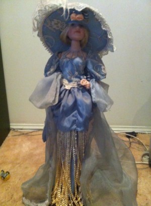 doll in blue dress with large hat