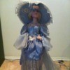 doll in blue dress with large hat
