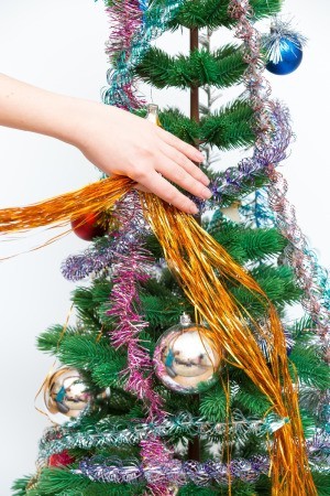 hand decorating tree