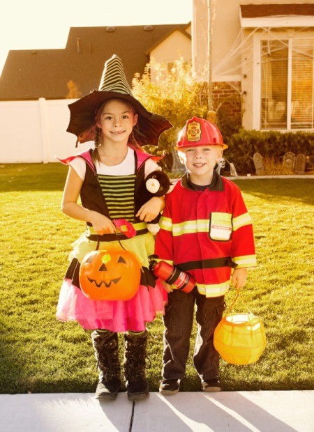 Kids trick or treating on Halloween.