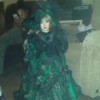 large doll in fancy green dress