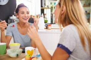 2 woman eating breakfast