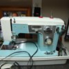 blue and beige sewing machine