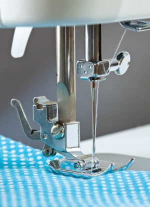 closeup of sewing machine foot and needle