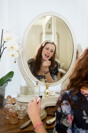 woman applying cosmetics