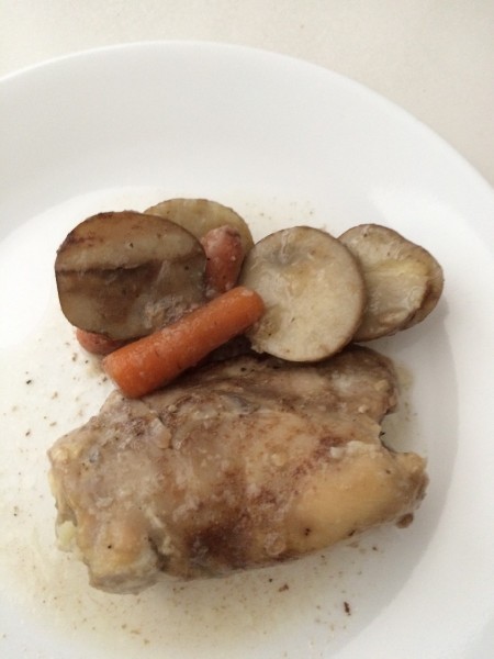 A plate of chicken and vegetables.