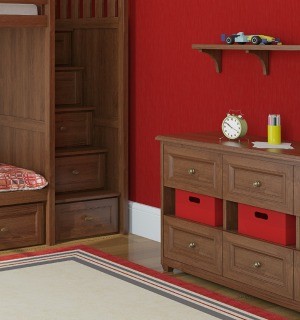 A red bedrooms its white baseboards.