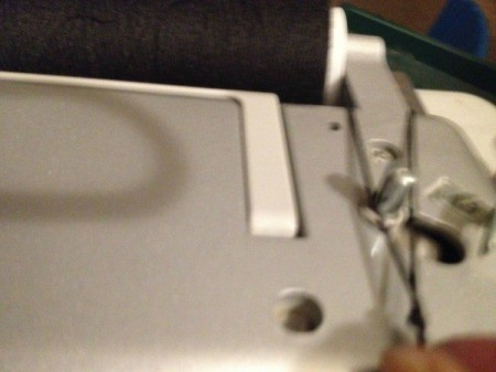 Using Large Spools on a Sewing Machine -  then stretch it over to the bobbin winder and tie