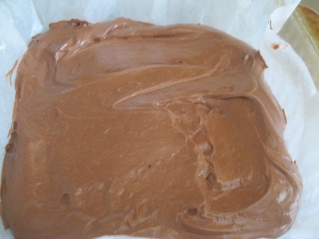 Whipped chocolate truffle candy on a surface.