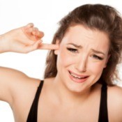 Woman Concerned About Her Ear