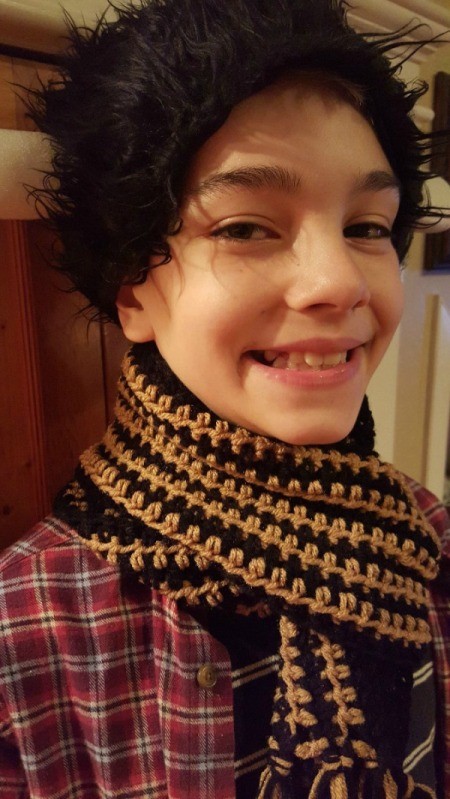 young boy wearing the scarf