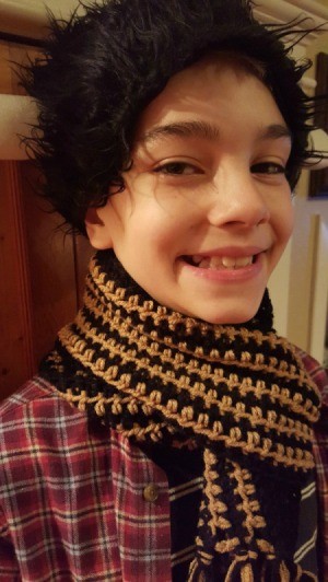 young boy wearing the scarf