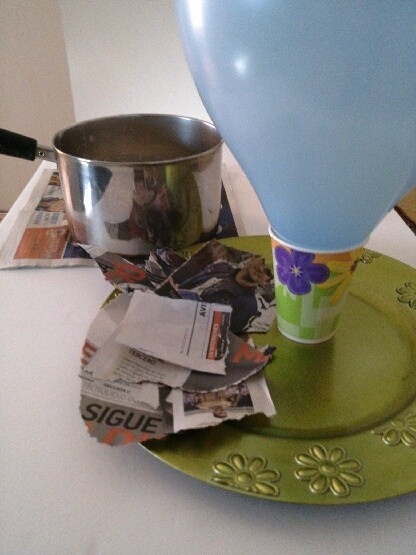 Making a balloon covered in paper-maché.