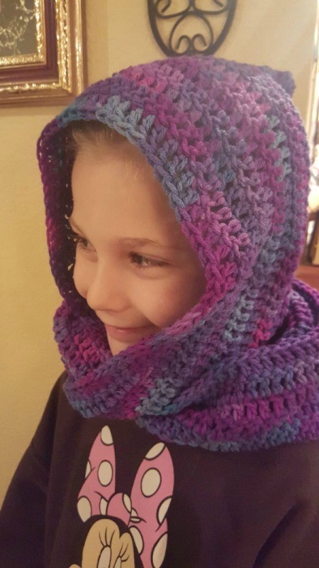 young girl wearing crochet hooded scarf