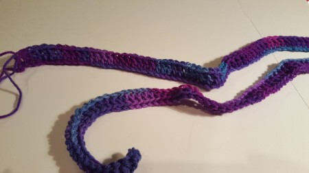 make a double crochet in the chain stitches for the hooded scarf