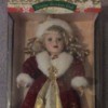 doll in fancy red cape with white fur trim