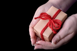 hands holding a wrapped gift