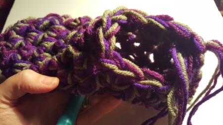 Thick Crocheted Slippers - attach your yarn with a sc at the back of the heel.  Work 11 more sc around the opening for a total of 12 sc.