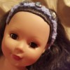 closeup of doll wearing the finished headband
