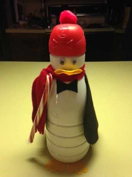 A penguin made from a decorated Coffeemate container.
