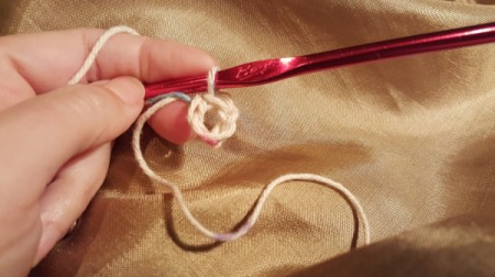 using cream yarn chain 5 and make a ring