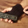 Crochet Men's Fingerless Gloves - person wearing gloves using a remote