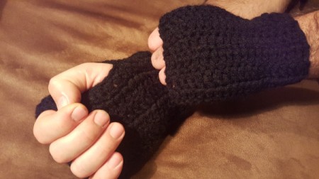 Crochet Men's Fingerless Gloves - Fasten off and weave in ends. Hands in gloves.