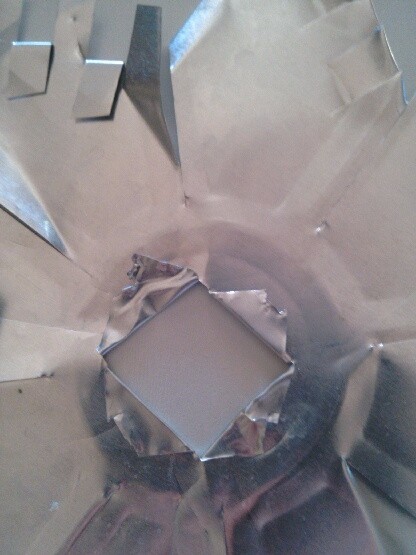 cut an X in the center circle and fold back