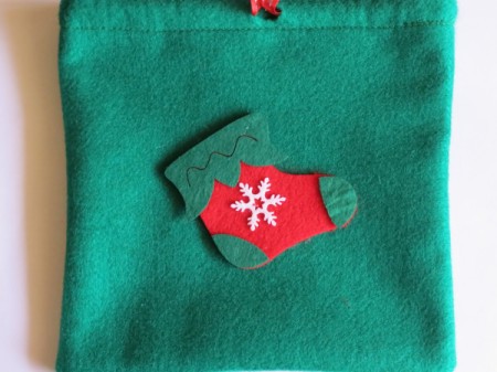 felt stocking decoration added to bag