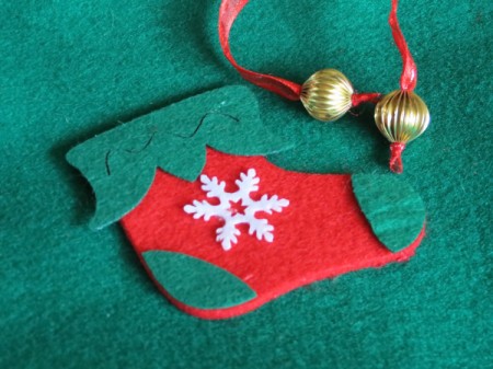 closeup of decoration and ends of pull cord