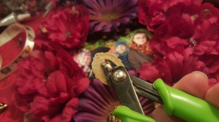 removing button shank in preparation for gluing to center of flower