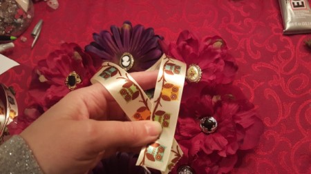 folding a length of ribbon to use as hanger