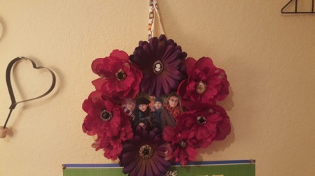photo wreath hanging on wall