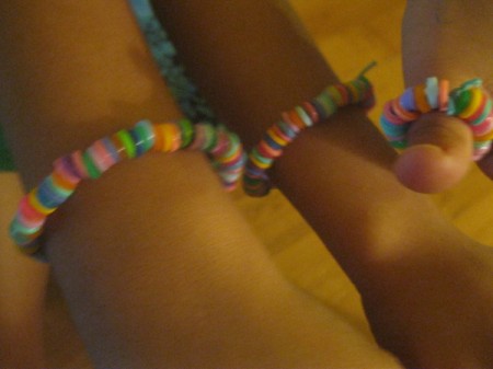 Melted Perler Beads - melted bead brackets on child's wrist, ankle, and thumb