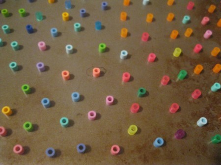 Melted Perler Beads - closeup of beads on pan before melting