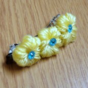 Yarn Flower Hair Clip - finished  clip with yellow yarn flowers