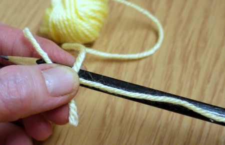 Yarn Flower Hair Clip - hold end of the yarn with your thumb