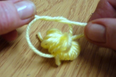 Yarn Flower Hair Clip - add a second tight knot